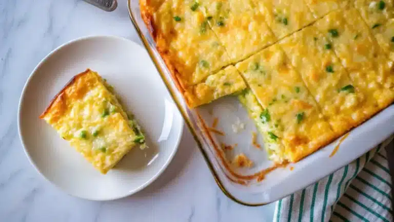 Baked Cottage Cheese Eggs in a rustic baking dish, golden and fluffy, garnished with fresh parsley—perfect for a high-protein breakfast.